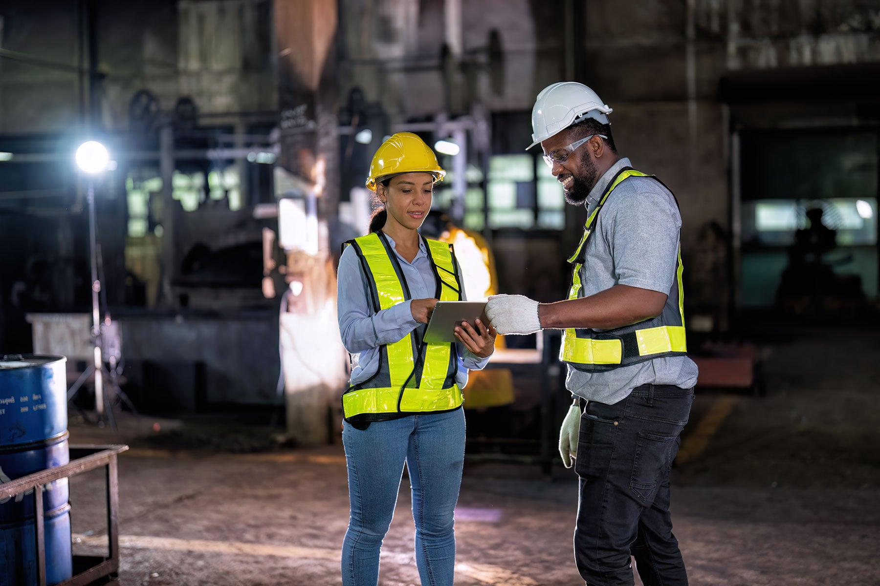 Maintenance engineer, and manager and factory discussing something on the tablet